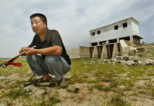 组图:湿地边变成牧场