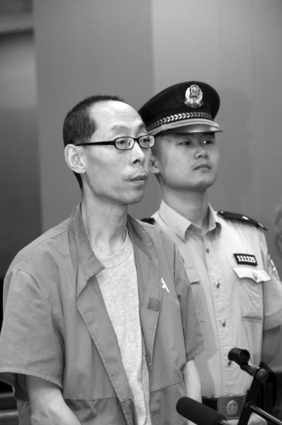 黄冠军受审。京华时报通讯员王鑫刚摄 黄冠军受审。京华时报通讯员王鑫刚摄