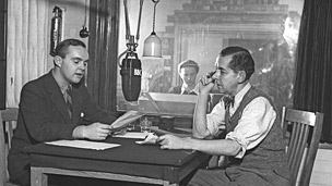 Two presenters in a BBC recording studio in 1943