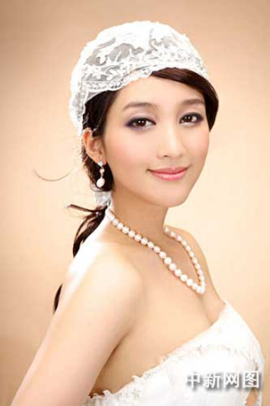 金莎婚纱写真酷似张韶涵(图)