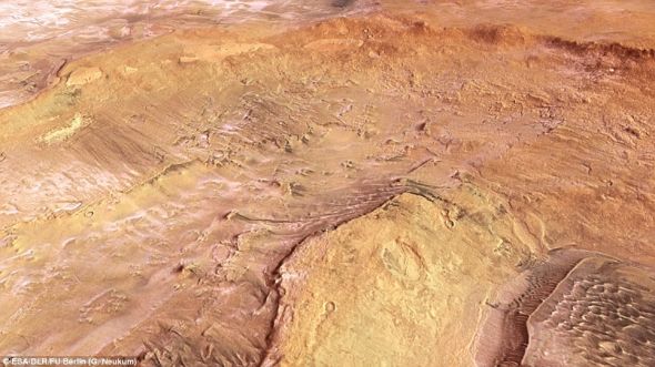 “火星快车”拍摄到的这颗红色行星上的阿尔及尔和霍克陨石坑，在图片右上角能够清楚看到冻结成冰的二氧化碳