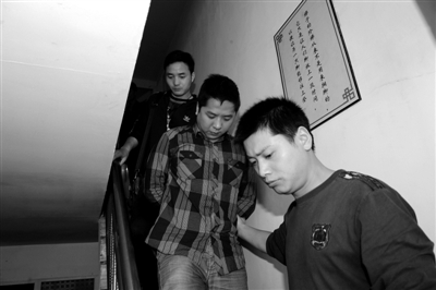 湖南长沙，被警方抓获的涉案人员。新京报记者 李超 摄