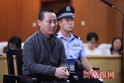 房山法院，被告人田某，正在法庭上接受询问。新京报记者 尹亚飞 摄