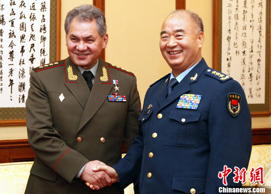     资料图：2012年许其亮会见绍伊古