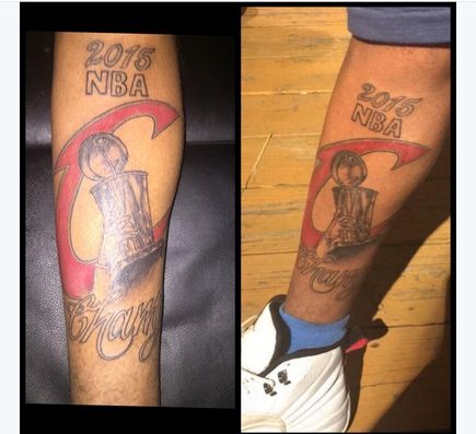 骑士球迷将总冠军奖杯纹在了身上